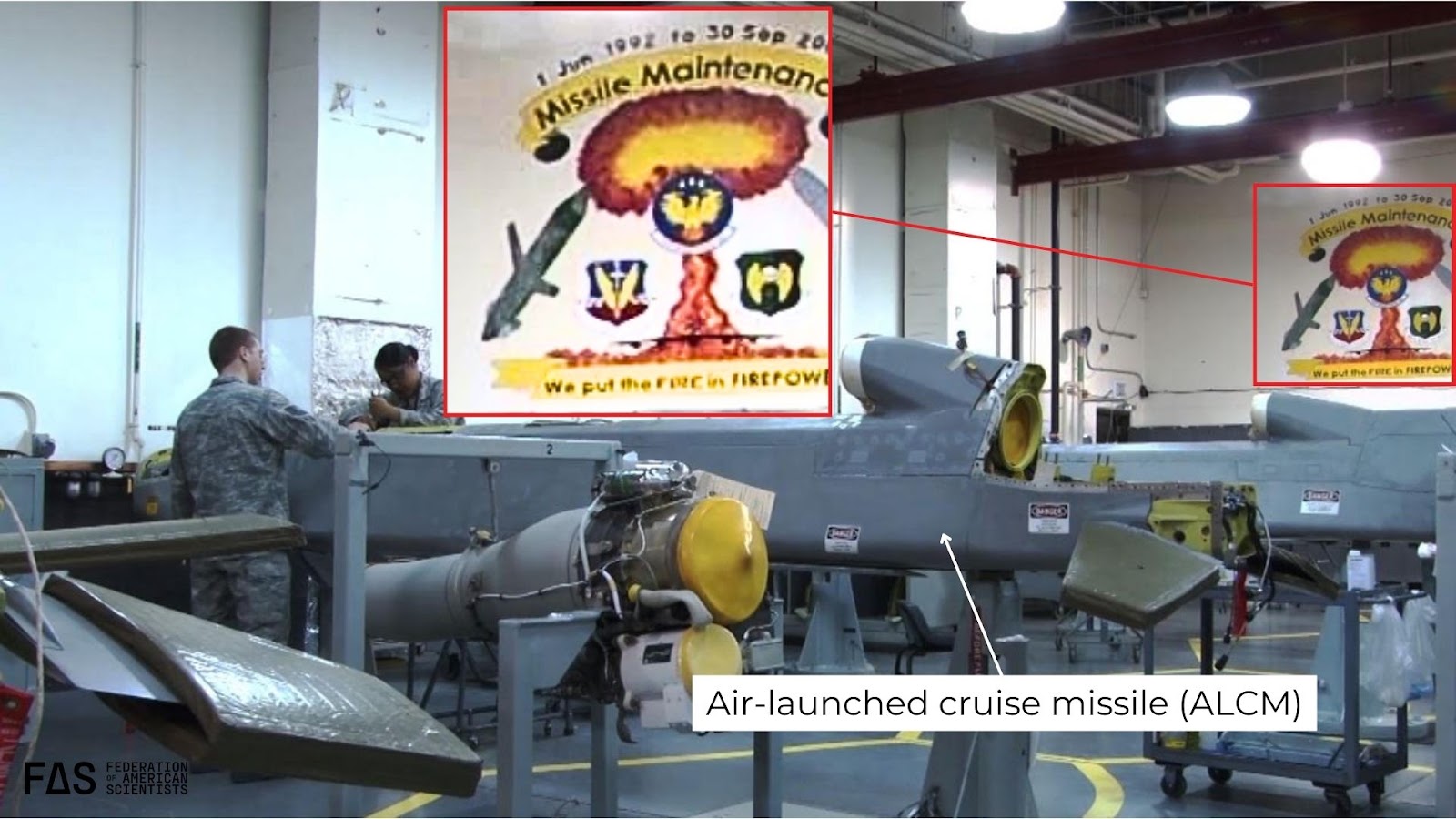 Image from US Air Force of inside ALCM maintenance facility at Barksdale AFB in 2013. The insignia on the wall shows a mushroom cloud and slogan reading “We put the FIRE in FIREPOWER.”