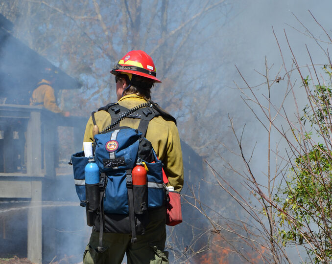 wildland firefighter performing a prescribed burn