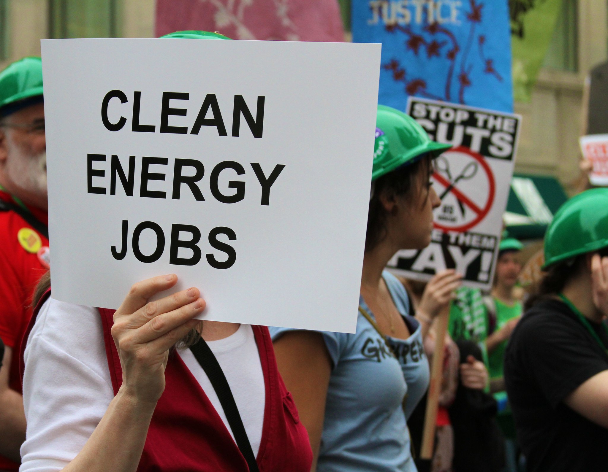 protester holding sign that reads 